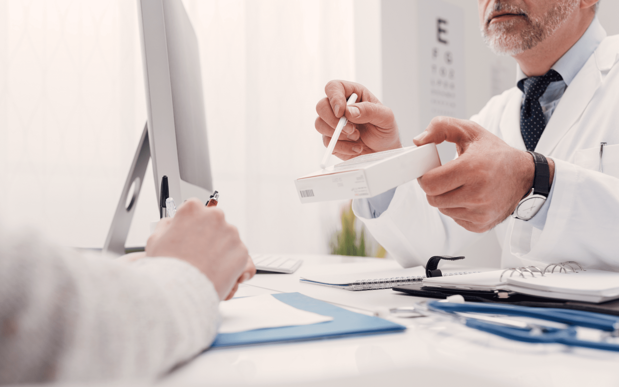 Doctor explains and points at treatment for patient.