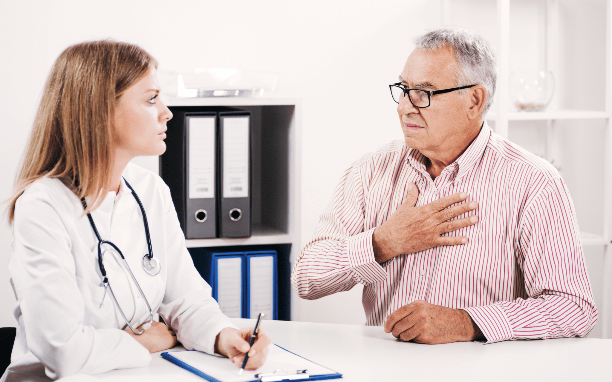 Doctor talking to veteran about possible complications.