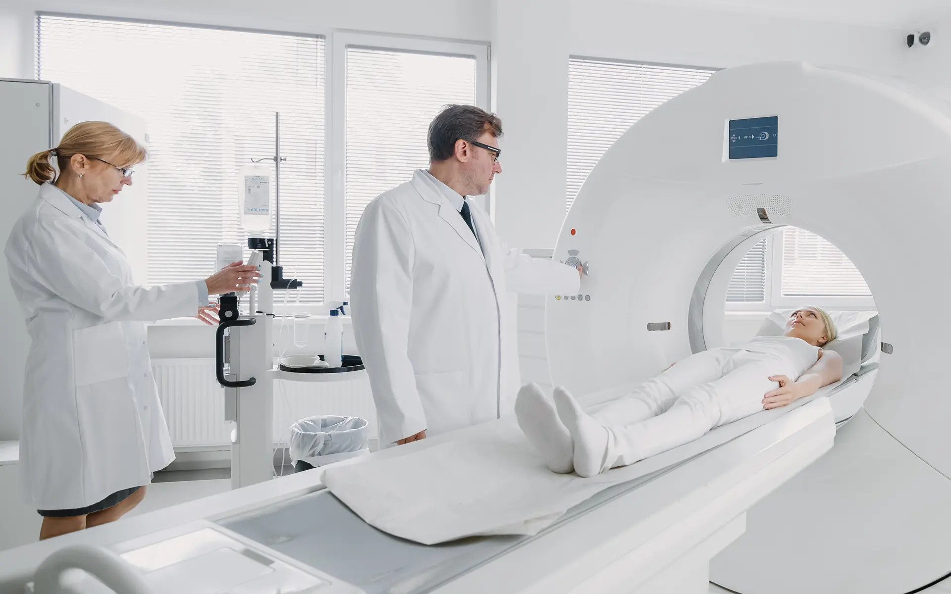 Two doctors administering targeted therapy to a patient.