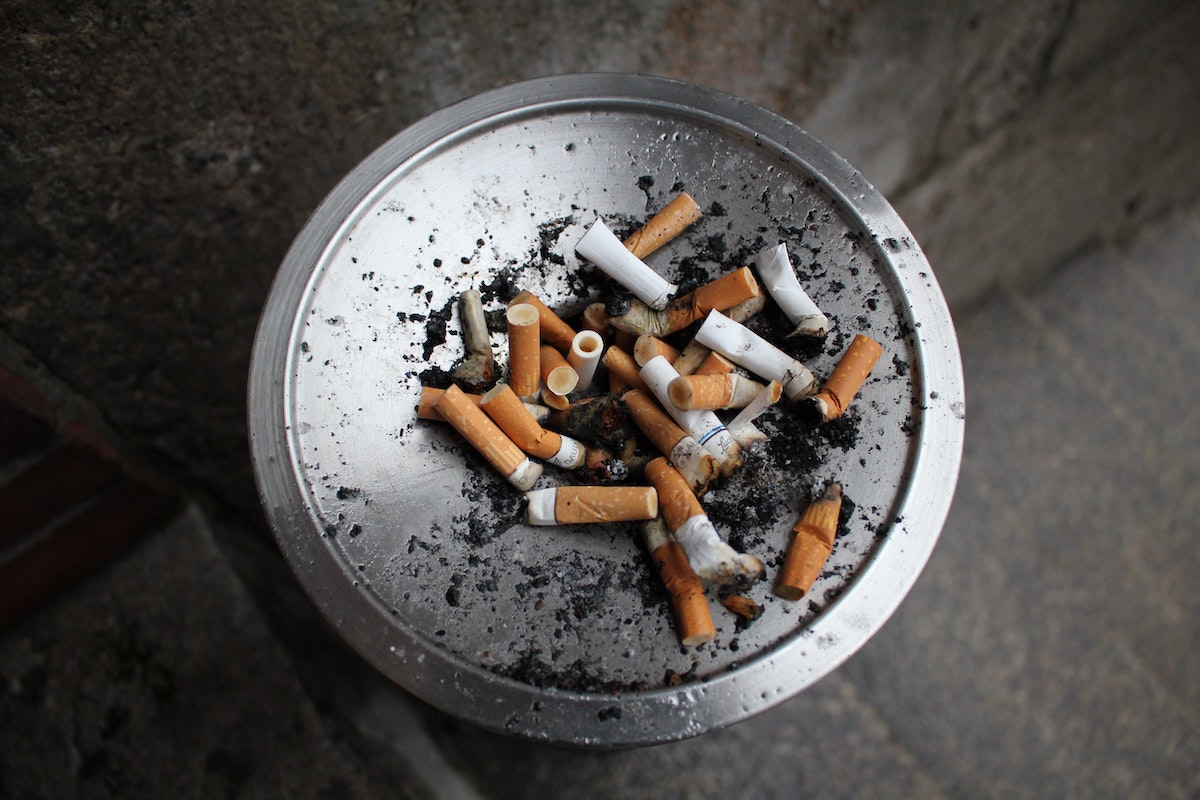 tray full of cigarette butts and ash from daily smoker