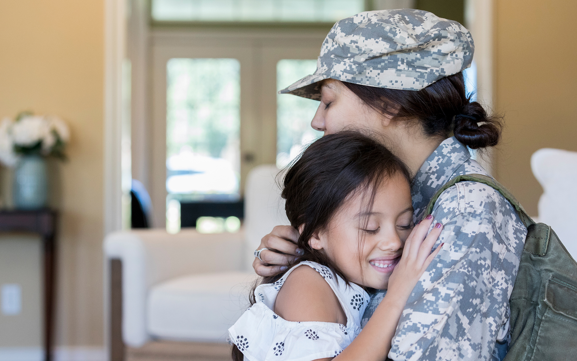 A veteran and her child having a loving embrace.