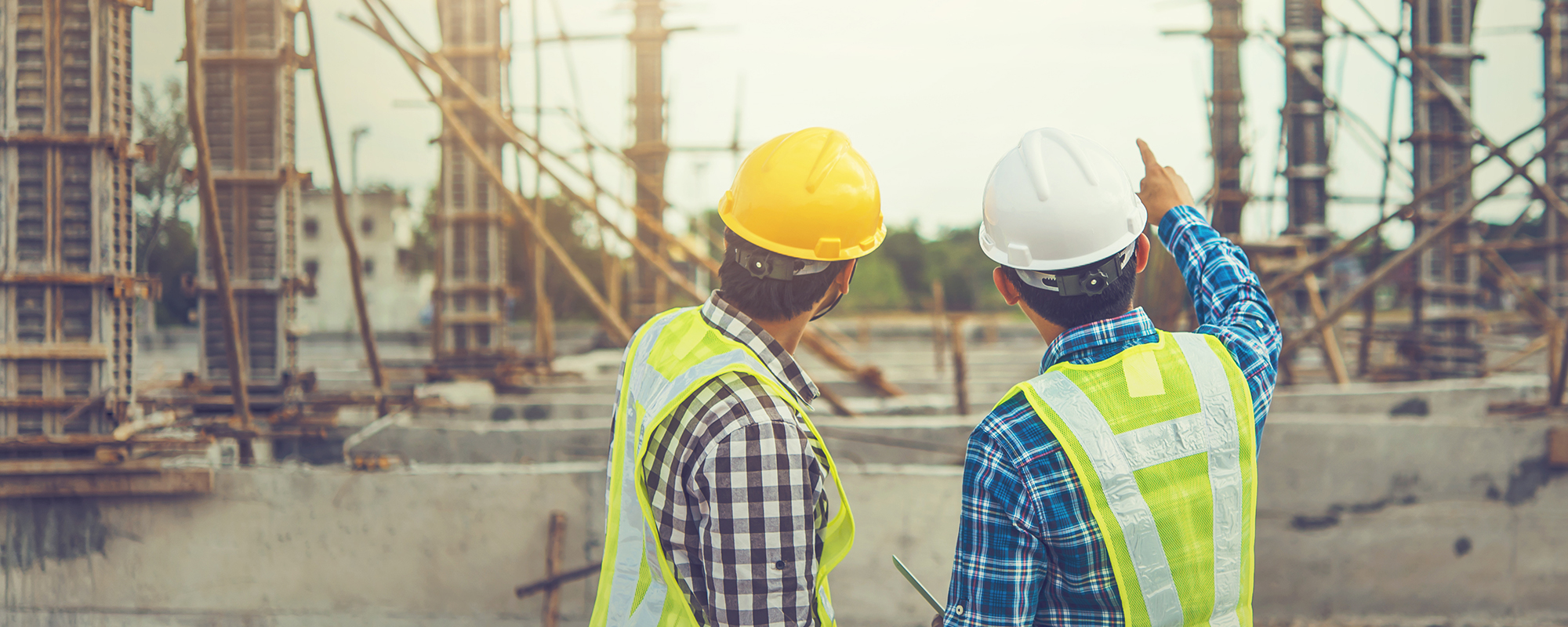 Two construction workers discussing the project ahead.