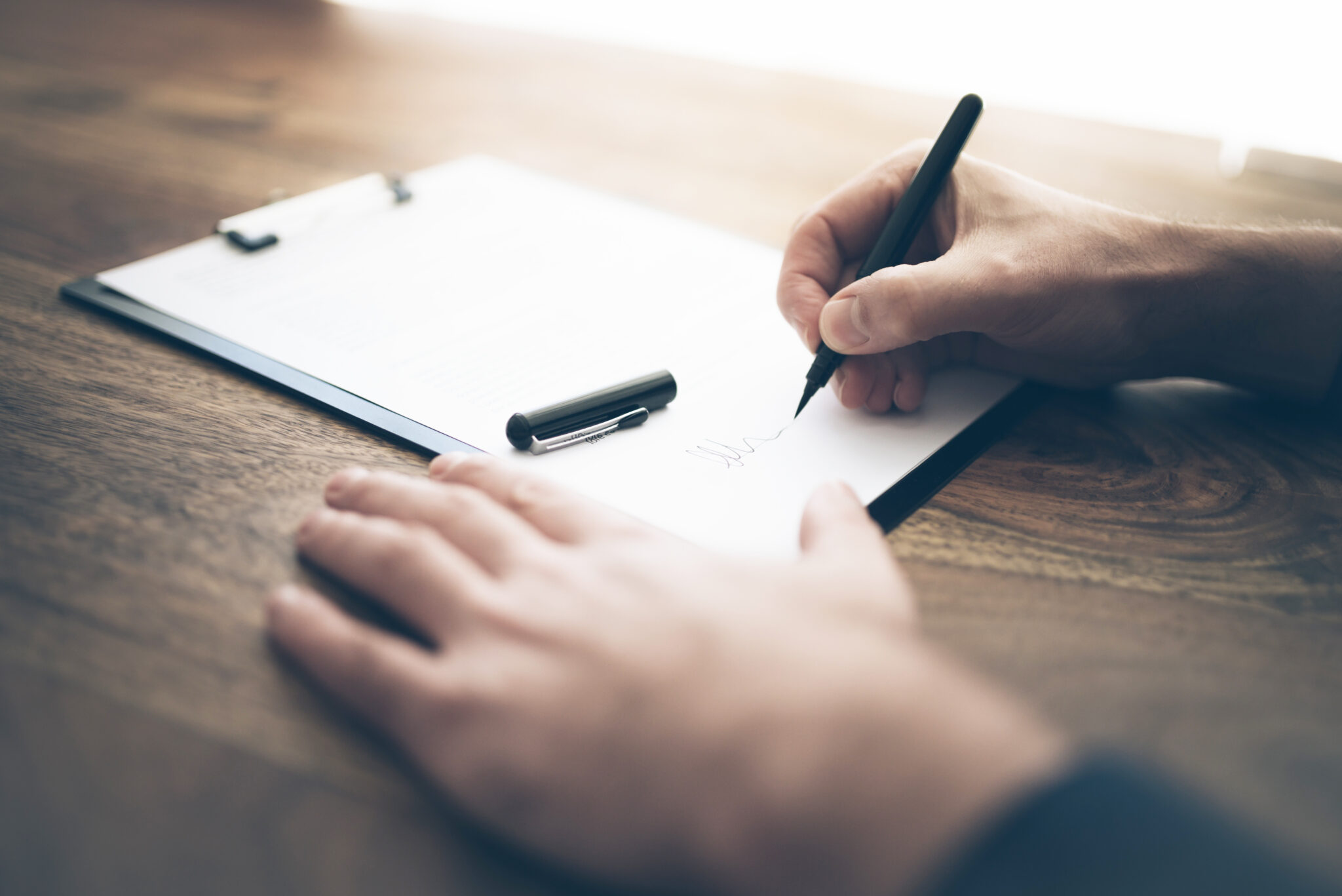 Veteran filling out forms to receive monetary benefits from the VA.