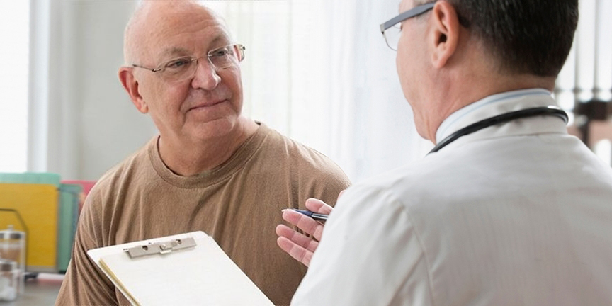 Veteran talking to VA doctor.