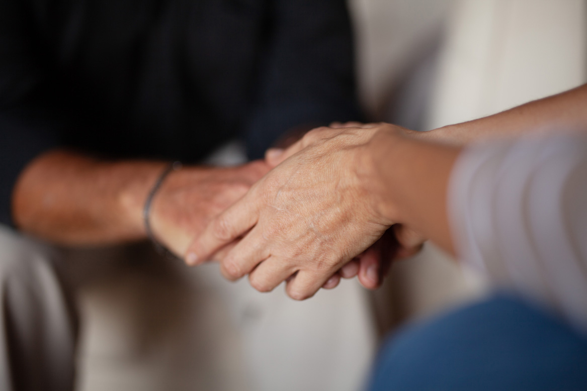 two people holding hands