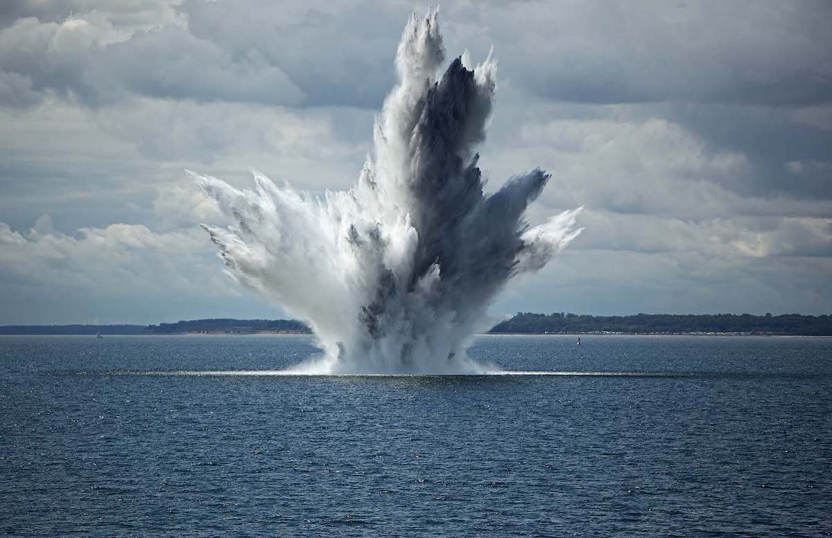 explosion underwater breaches the surface of the ocean