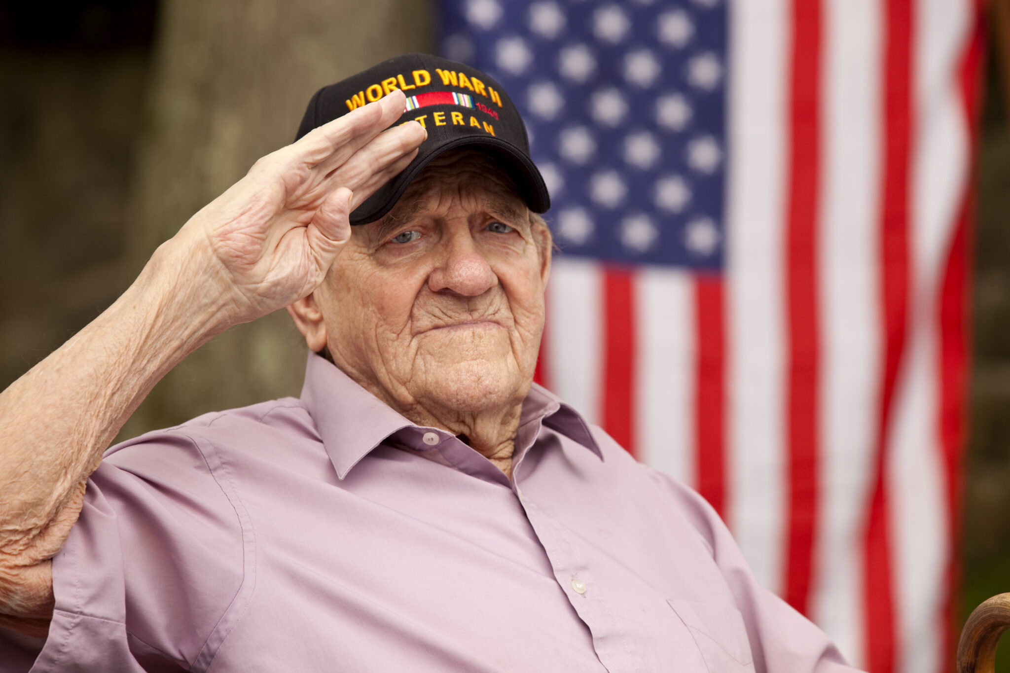 Senior veteran patient saluting