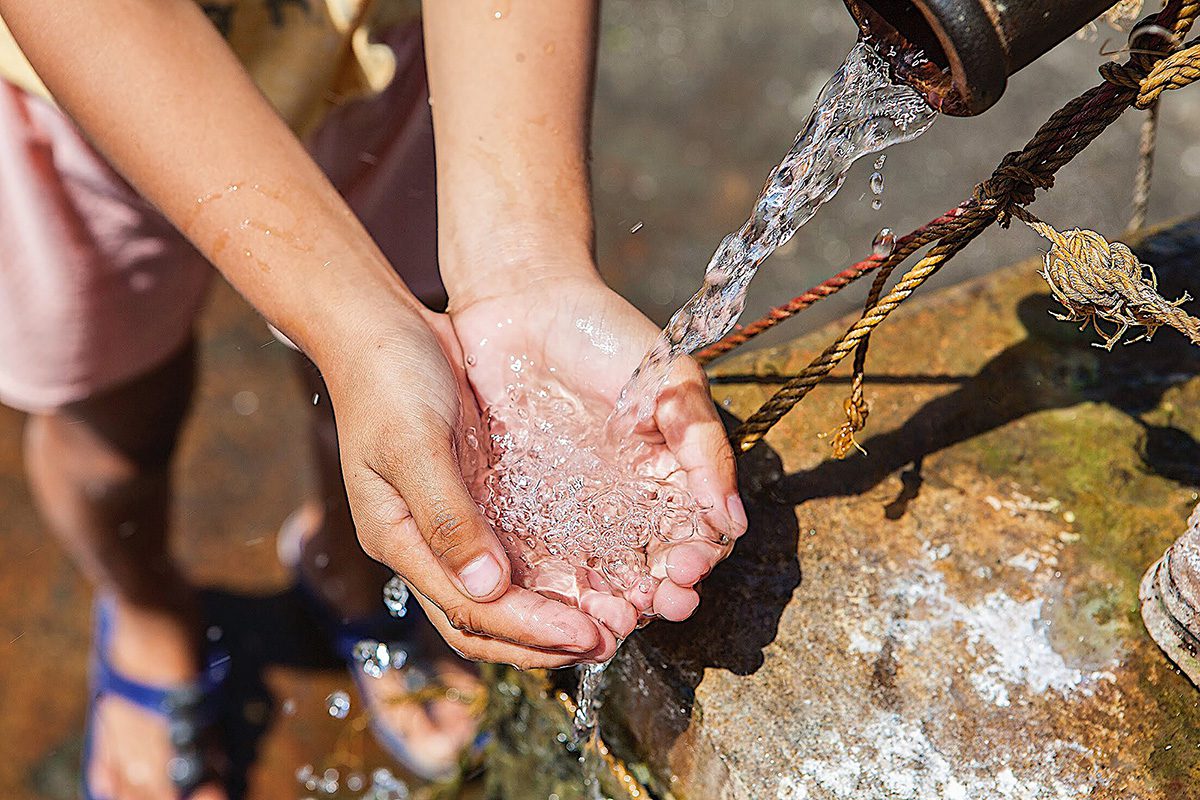 Contaminated water at Fort Ord army base being poured from drinking well into hands.