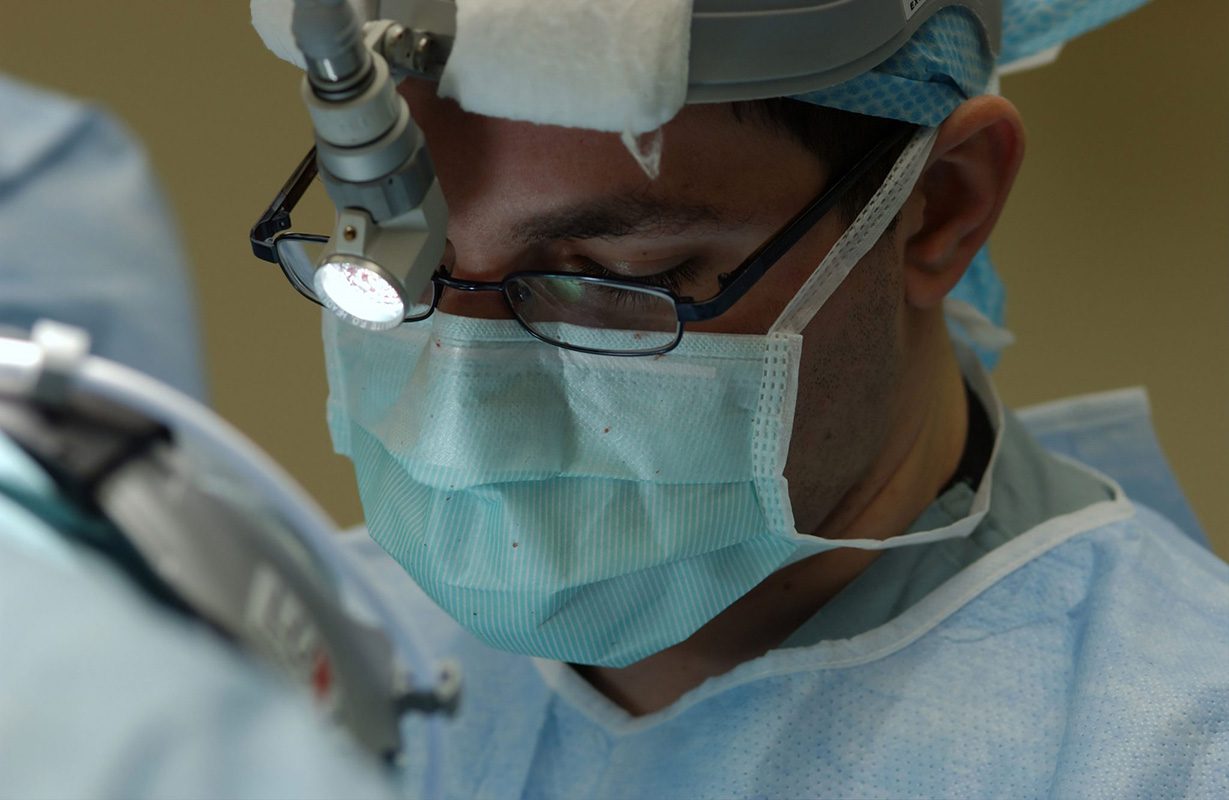 Doctor performing surgery at palo alto va medical center