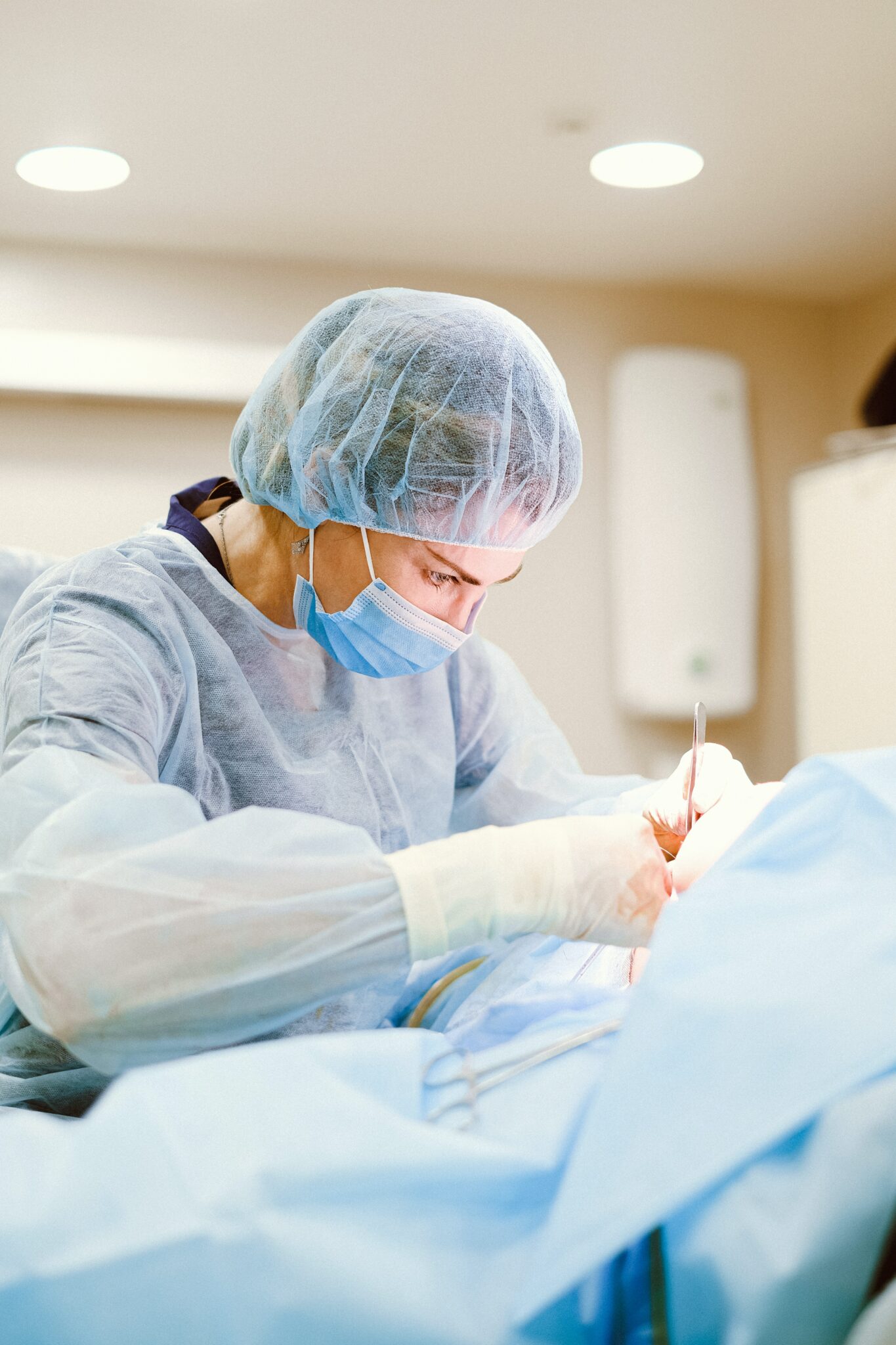 Female doctor performing surgery