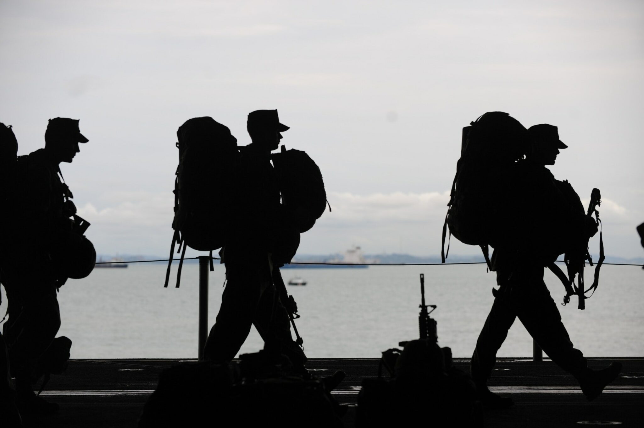 Silhouette of soldiers walking