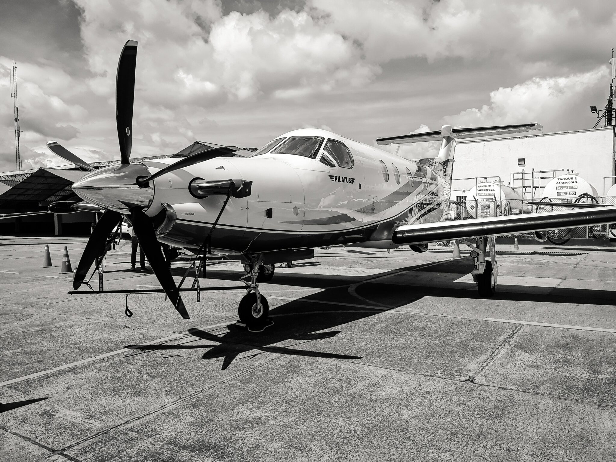 Military plane at air station in black and white