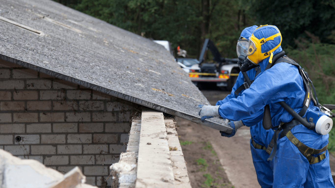 Certified asbestos abatement technicians are disposing asbestos roofing materials.
